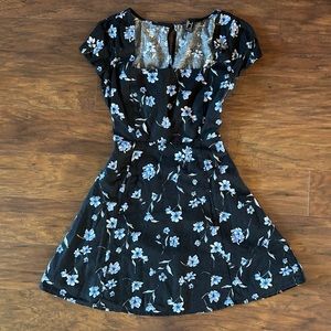 Black dress with blue flowers and cutout in the back